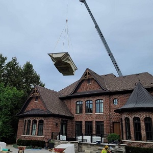 Crane Above Home with Fiberglass Pool